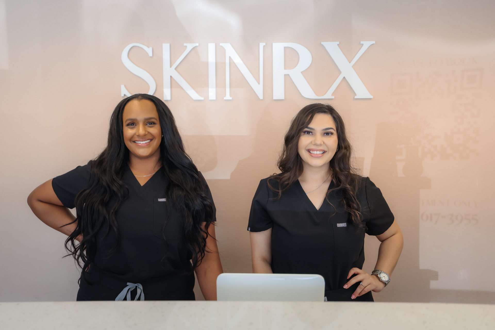 Nayah and Evelyn, co-founders of SkinRx, at the front desk